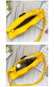 Detail view of yellow crossbody bag interior showing space for phone and accessories