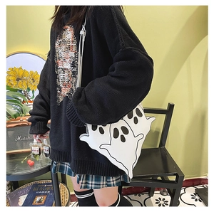 Ghost-shaped crossbody bag shown in a stylish retro interior with Marshall speaker