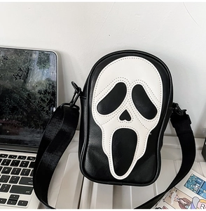 Detail of Scream Ghostface pattern on black crossbody bag with adjustable strap