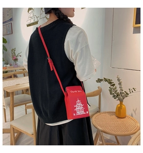 Detail of red leather crossbody bag in takeout box shape with pagoda print