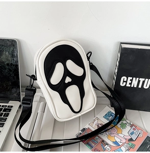 Detail of the ghost face mask crossbody bag with black and white color contrast design