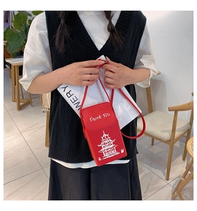 Close-up of red denim box bag featuring white Eiffel Tower print and Thank You text