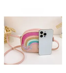 Kids rainbow crossbody bag size comparison showing dimensions next to a smartphone