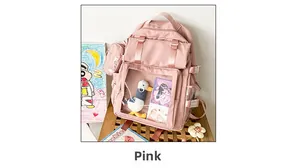 Pink nylon ita bag featuring a transparent display window with a plush duck toy inside