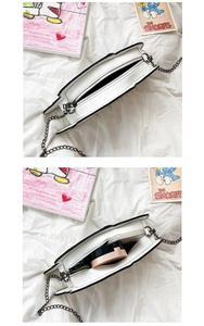 Detail of creative hat-shaped shoulder bag showing zipper closure and inner storage space