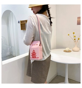 Pink takeout box crossbody bag featuring Thank You print and elegant chain strap detail