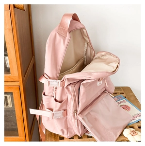 Detailed internal compartments of pink school backpack with laptop sleeve and multi-pockets