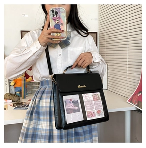 Detail view of black PU leather shoulder bag with unique dual transparent card slots
