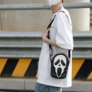 Street style crossbody bag featuring iconic ghostface mask pattern with adjustable strap