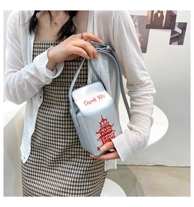 Detail of silver milk box crossbody bag with pagoda print and Thank You text