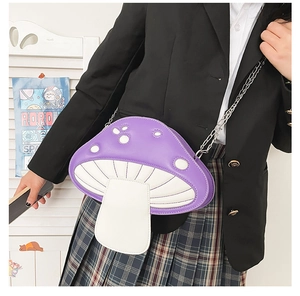 Girl wearing a purple mushroom shaped shoulder bag with silver metal chain strap