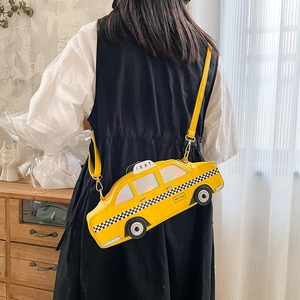 Creative yellow NYC taxi shaped crossbody bag for women with adjustable shoulder strap