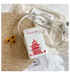 Close-up of creative takeout box shoulder bag with red pagoda and Thank You print