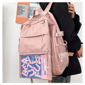 Detail view of pink nylon backpack with transparent PVC slot and aesthetic aesthetic card