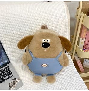 Detail shot of Gromit-style plush dog backpack showing soft texture and blue overalls