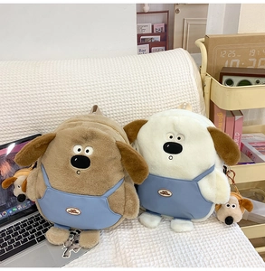 Close-up of cute plush dog backpack featuring blue denim overalls and mini charm
