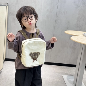 Cute teddy bear toddler backpack in cream canvas with plush patch and brown straps