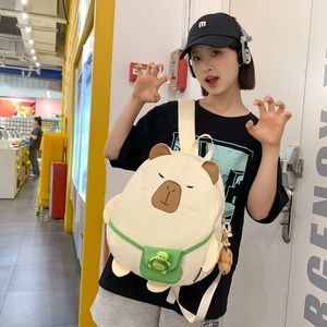 Cute Capybara canvas backpack for women featuring a green turtle pocket and plush charm