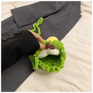 Detailed close-up of handmade crochet durian mini shoulder bag with vibrant wool texture