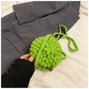 Detailed macro view of the 3D bobble crochet texture on the neon green durian-style bag