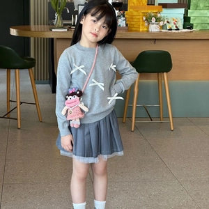 Girl's grey knit sweater with 3D bows and cute pink crochet sausage doll shoulder bag