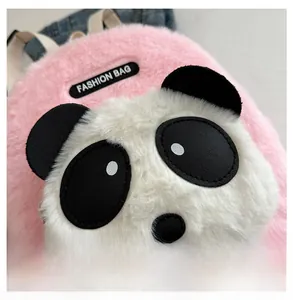 Detail of pink plush panda backpack with a black fashion bag label and soft texture