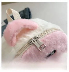 Detail of smooth metal zipper on pink plush children panda backpack with fashion tag