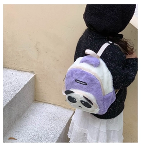 Detail of cute purple plush panda backpack for kids with soft texture and fashion label
