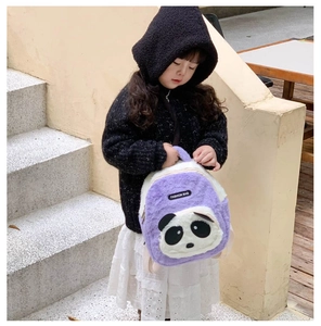 Detail of cute purple plush panda backpack with soft faux fur and fashion tag for toddlers