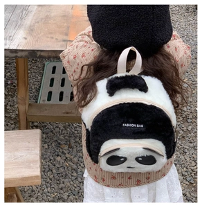 Detail of soft plush panda backpack showing comfortable straps and fuzzy texture
