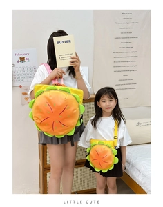 Detail of parent-child burger backpack and crossbody bag set in bright yellow and orange