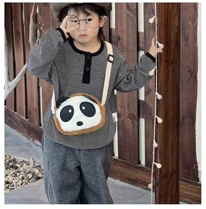Detail of plush panda crossbody bag with adjustable strap for kids outdoors