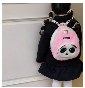 Toddler plush panda backpack in pink and white shown on child model from back view