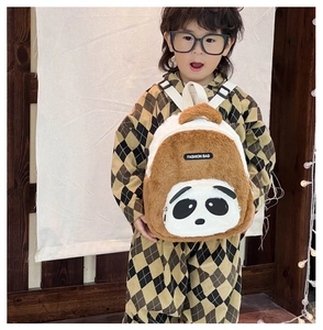 Detail of soft plush panda toddler backpack showing furry texture and white straps