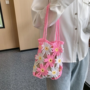 Handmade crochet floral handbag with pink daisy pattern and long shoulder strap