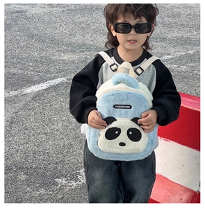 Detailed close-up of a blue plush panda backpack featuring a Fashion Bag woven label
