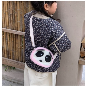 Close-up of a cute plush panda shoulder bag with pink faux fur trim and fabric strap