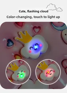 Detail showing the colorful LED glowing cloud ornament with touch sensor color change