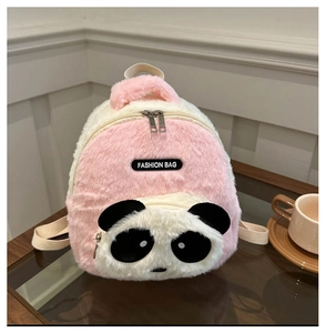 Detailed close-up of pink and white plush panda backpack with soft fur and zipper detail