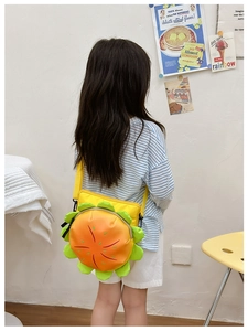 Child wearing a cute 3D hamburger style yellow crossbody bag with adjustable strap