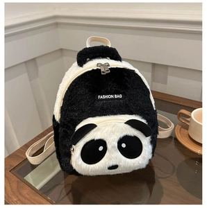 Detail of plush panda backpack with dual metal zippers and a fashion leather label
