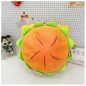 Close-up of creative hamburger shaped crossbody bag with realistic lettuce and sesame details