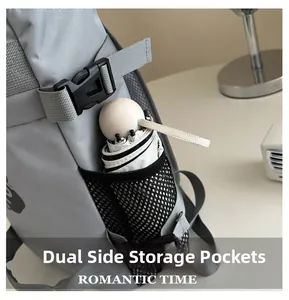 Detail of the gray backpack side mesh pocket holding a white folding umbrella