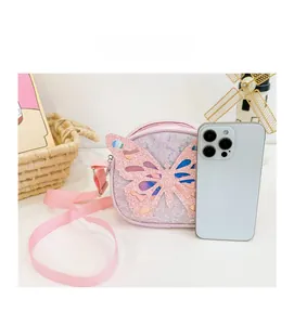 Pink sequin butterfly crossbody bag for kids with adjustable strap and size comparison