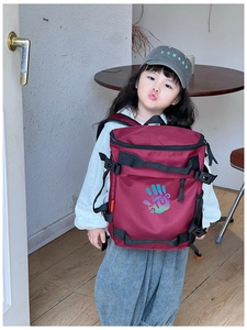 Burgundy kids backpack with stop handprint graphic and mesh side water bottle pocket