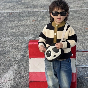 Cute panda plush crossbody bag for kids shown in outdoor street style fashion view