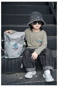 Kids streetwear style with gray multi-pocket backpack and embroidered trendy bucket hat