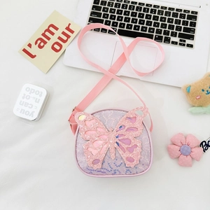 Detailed close-up of a kids' sequin crossbody bag with a large glitter butterfly decoration