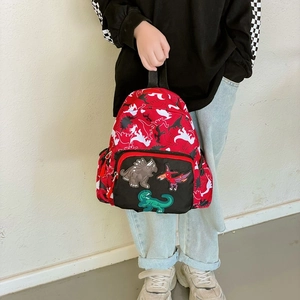 Zaino rosso per bambini con ricami di dinosauri e motivi a silhouette bianche