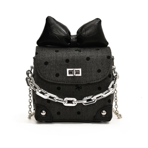 Mini crossbody bag with large black bow, polka dot pattern and silver chain detail